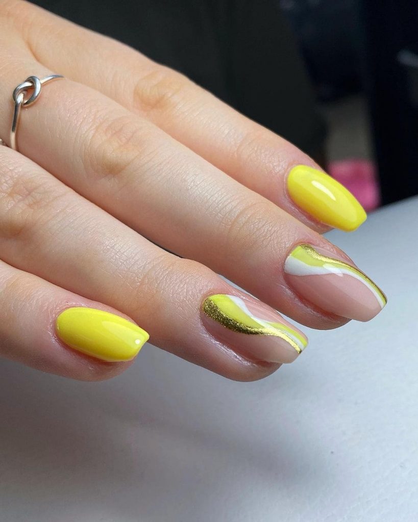 yellow bright summer nails with gold