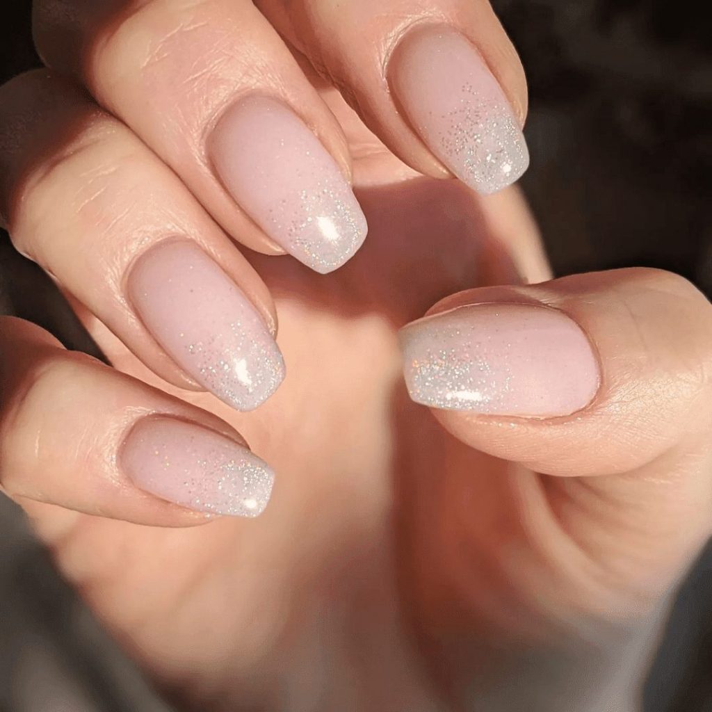 Perfectly designed silver bands on a pink nail polish may look outstanding