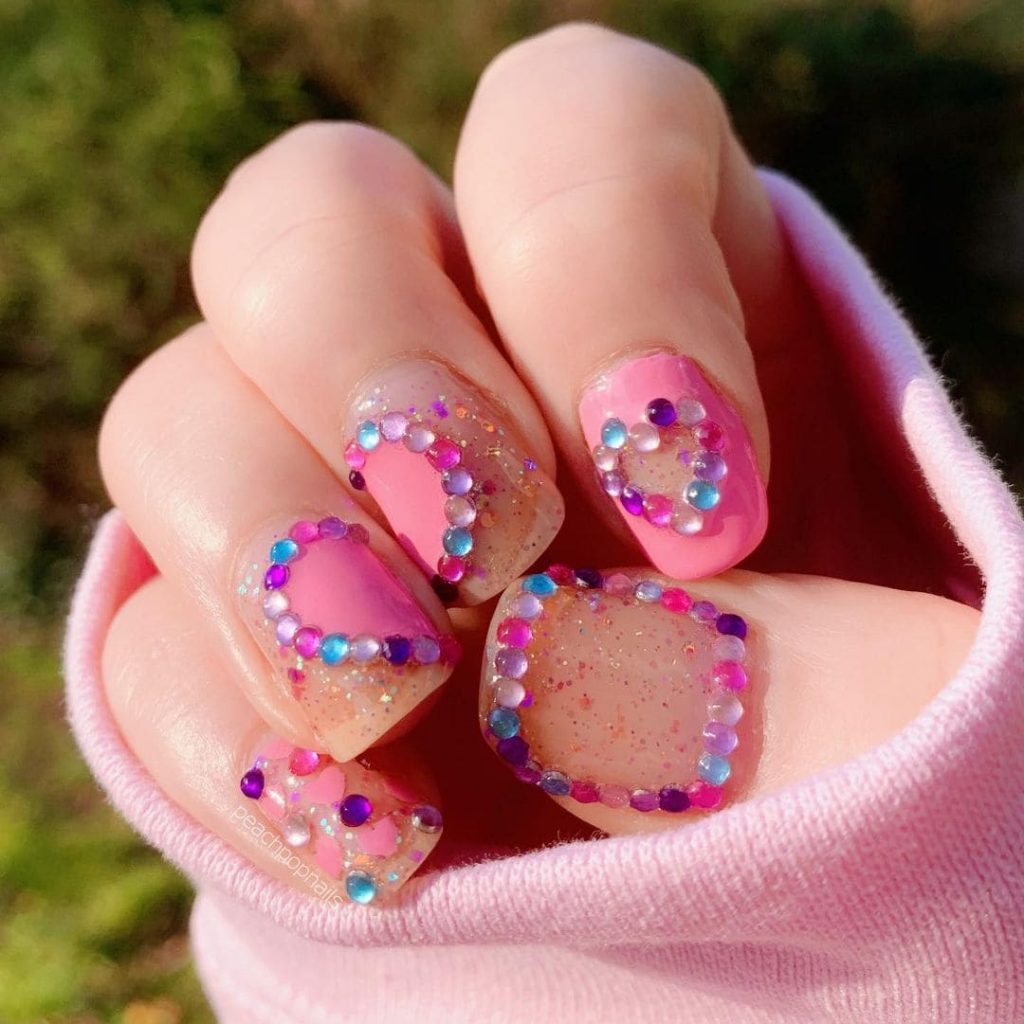 You will look elegant in this unique heart nail design.