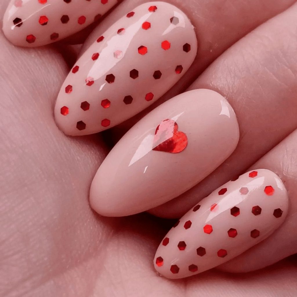 The sported heart nail design will be perfect for valentine and engagement parties