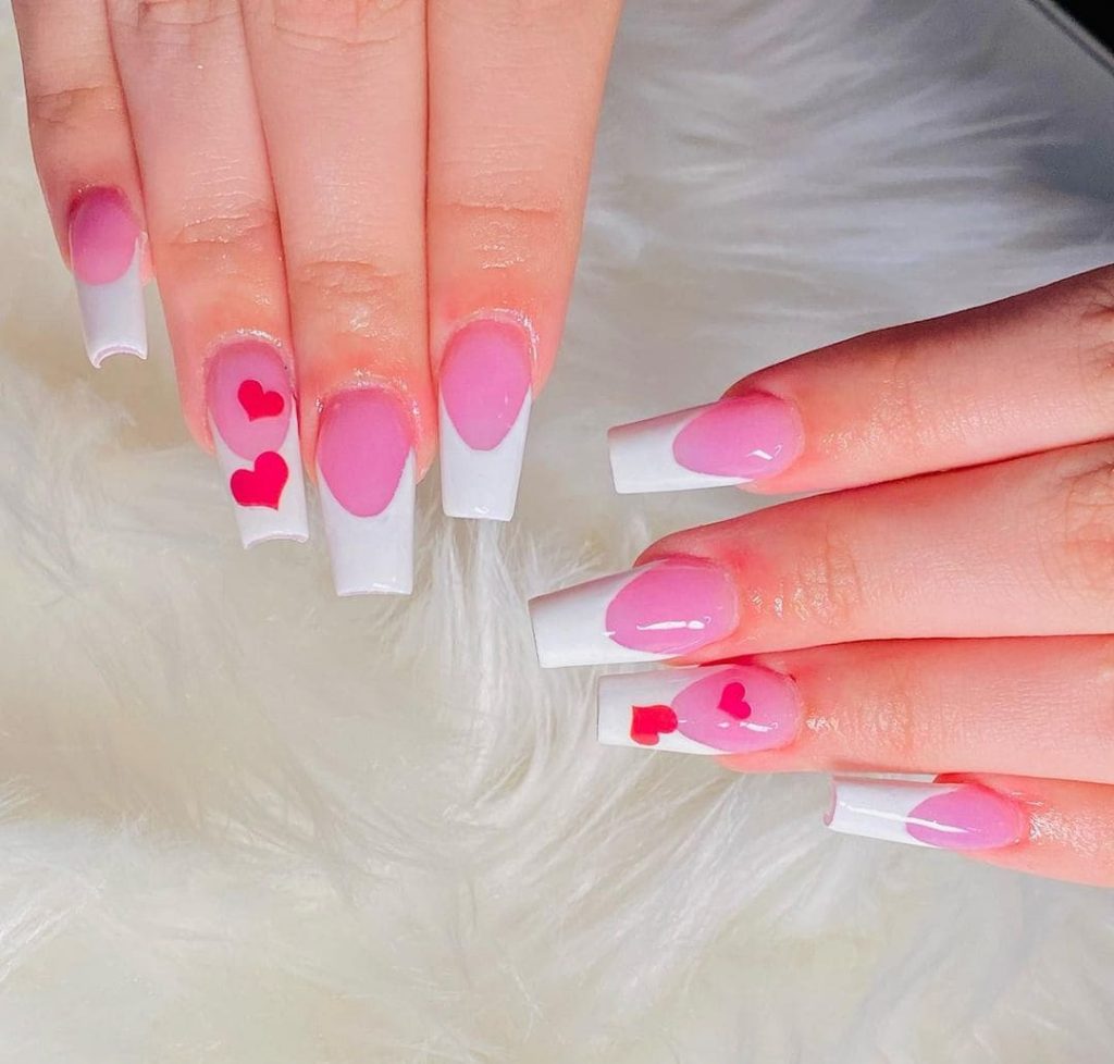 Heart nail stickers will make your long white nails spectacular.