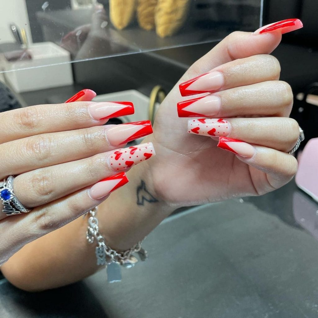 You will not regret trying out this spectacular heart nail design