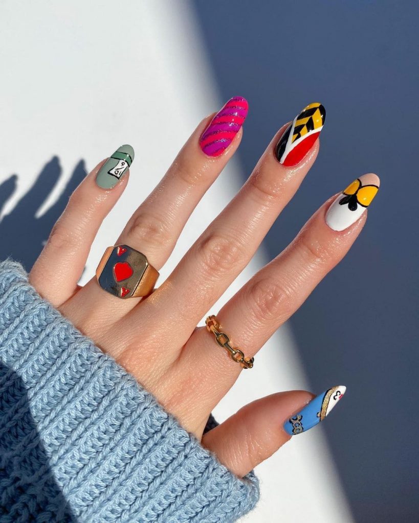 These Alice in Wonderland Nail Art for holiday nail inspo