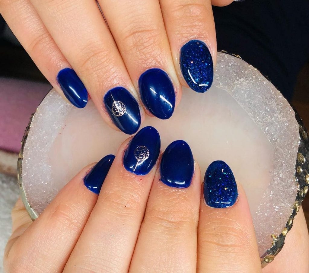 Royalty blue glitter nail art design for Christmas